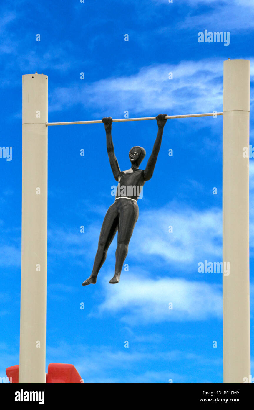 Trapeze artist swinging on horizontal bar Stock Photo Alamy