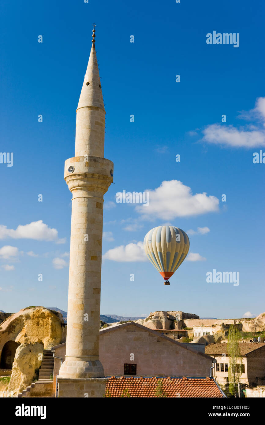 Hot Air Balloon and Mosque in the town of Urgup, Cappadocia, Turkey Stock Photo