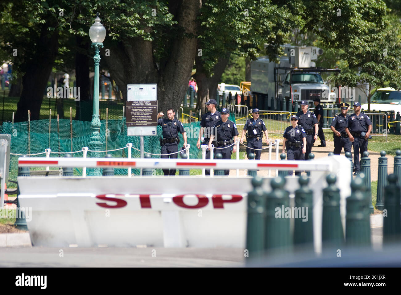 Capitol police officers sweep the U.S. Capitol grounds after a suspicious package is found. Stock Photo