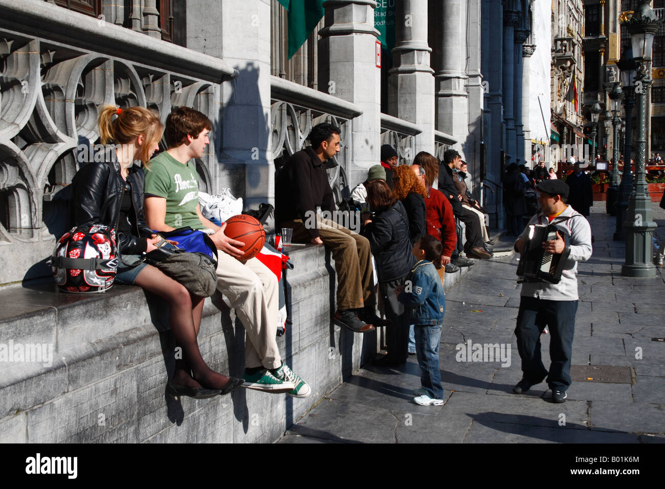 People relaxing at the Grand Place, Brussels, Belgium April, 2008 Stock Photo