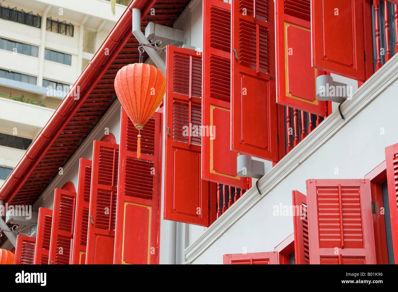 View of windows with shutters on second story apartment in Singapore Stock ...