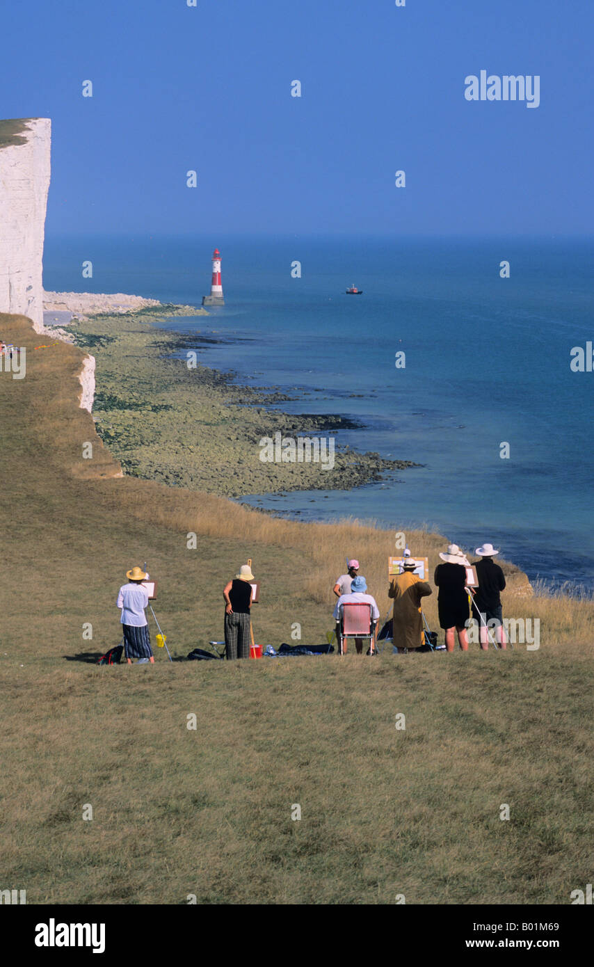 Art class painting view of the lighthouse at Beachy Head, Eastbourne
