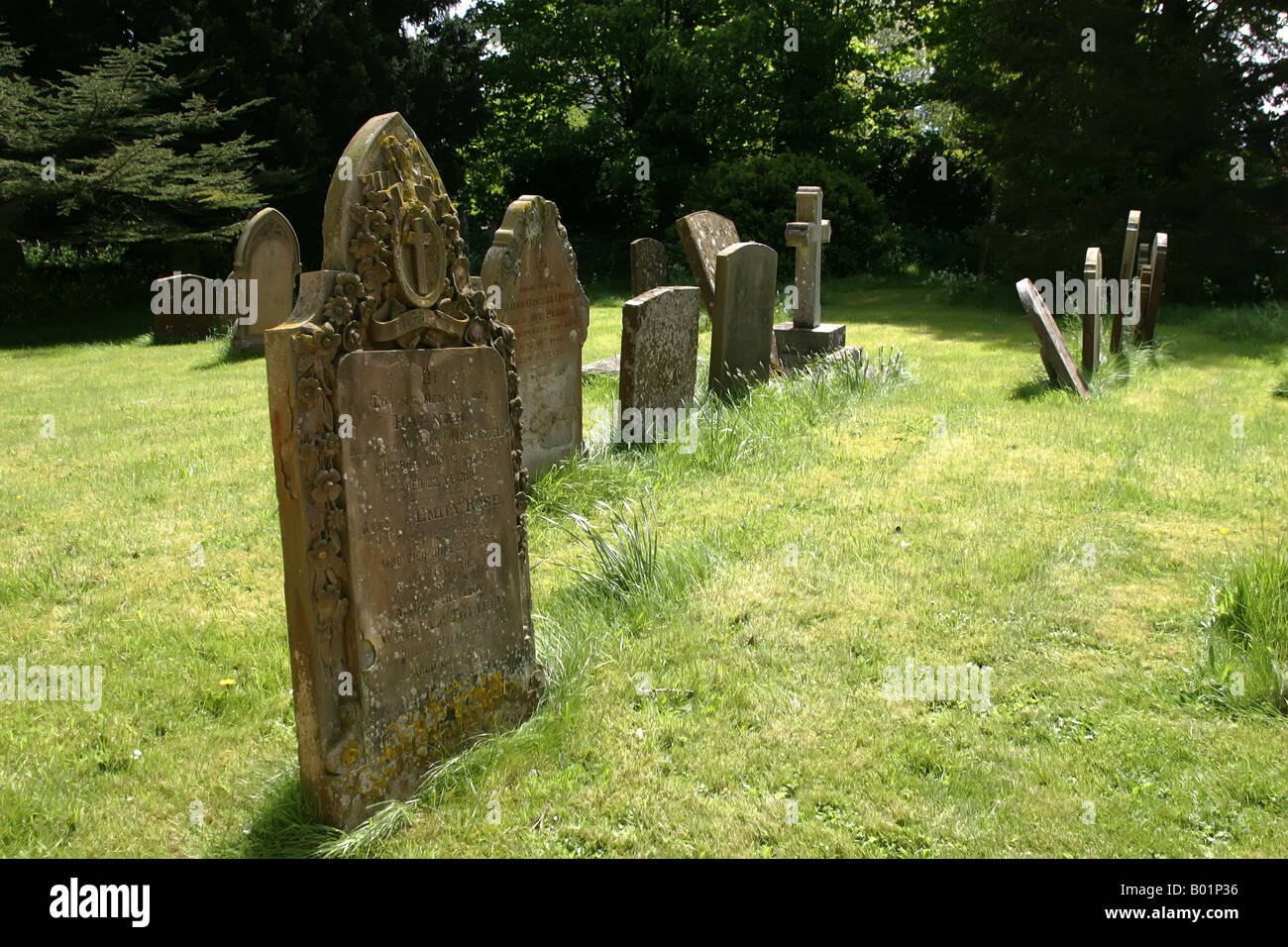 Gravestones in the graveyard of St Michael's Church, Stewkley, Buckinghamshire, UK Stock Photo