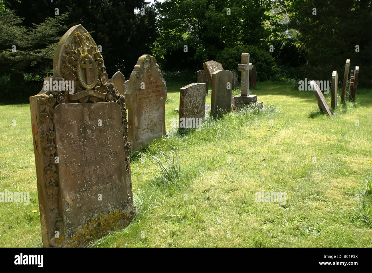 Tombstones in the graveyard of St Michael's Church, Stewkley, Buckinghamshire, UK Stock Photo