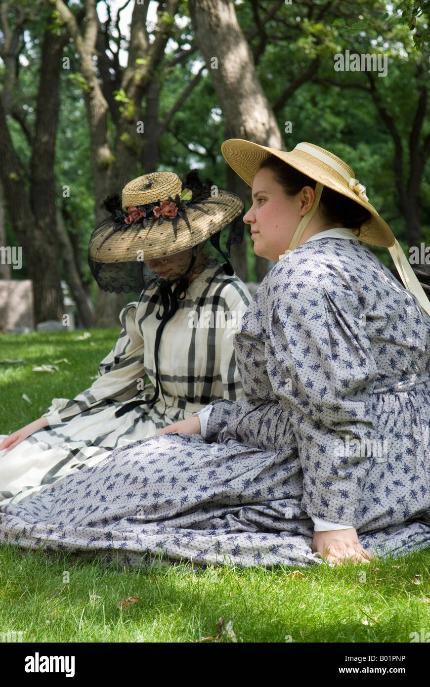 Two women dressed in Civil War period costume at Minneapolis' Lakewood Cemetery. Part of the annual Memorial Day celebration. Stock Photo