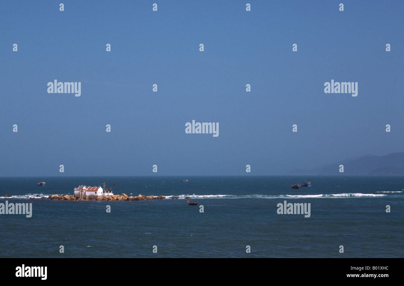 Feb 8, 2003 - Small house on a tiny island in the South China Sea off the coast of the Vietnamese city of Nhatrang. Stock Photo