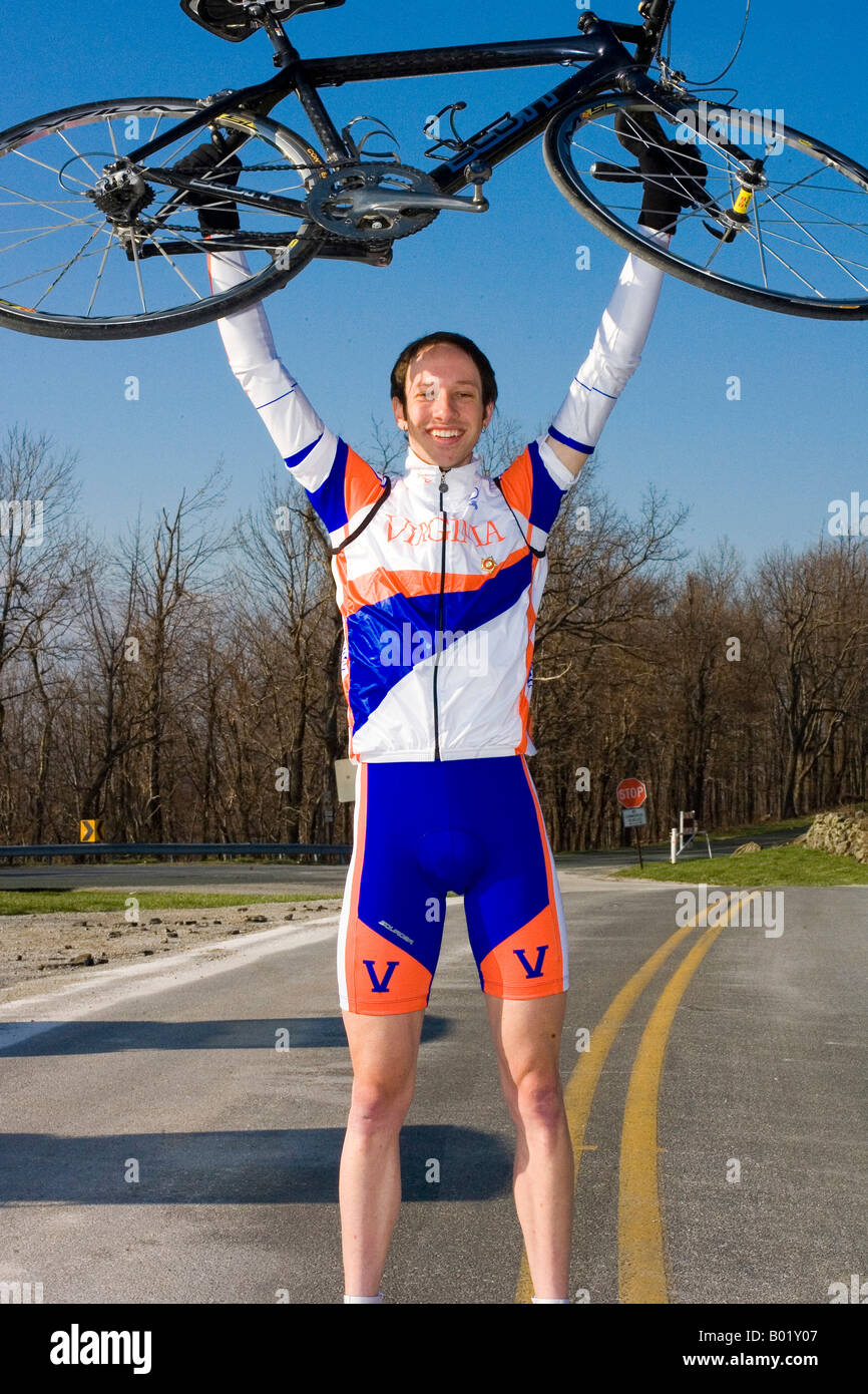 Adam Winck (University of Virginia Cycling team) lifts his bike at