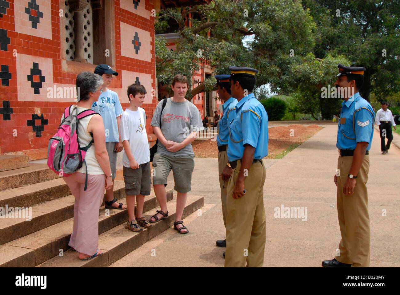 Kerala tourism police interacting with tourists Stock Photo - Alamy