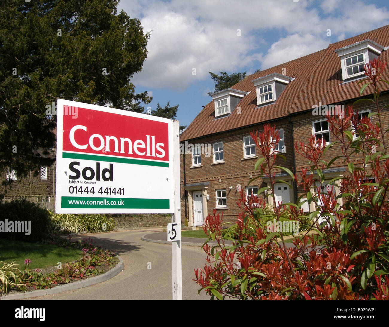 Estate Agents Sold Sign outside Modern House, Ardingly, West Sussex, England, UK, United Kingdom, Great Britain, Europe Stock Photo