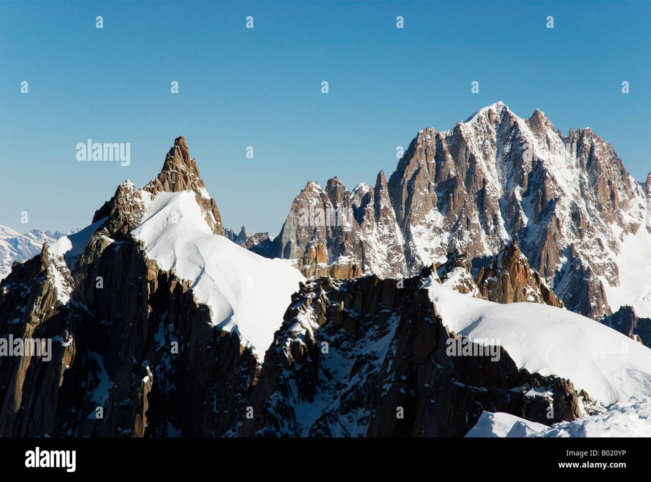 Aiguille du Midi - Aiguille du Plan ridge on Mont Blanc massif, Chamonix. Aiguille Verte in the background. Stock Photo