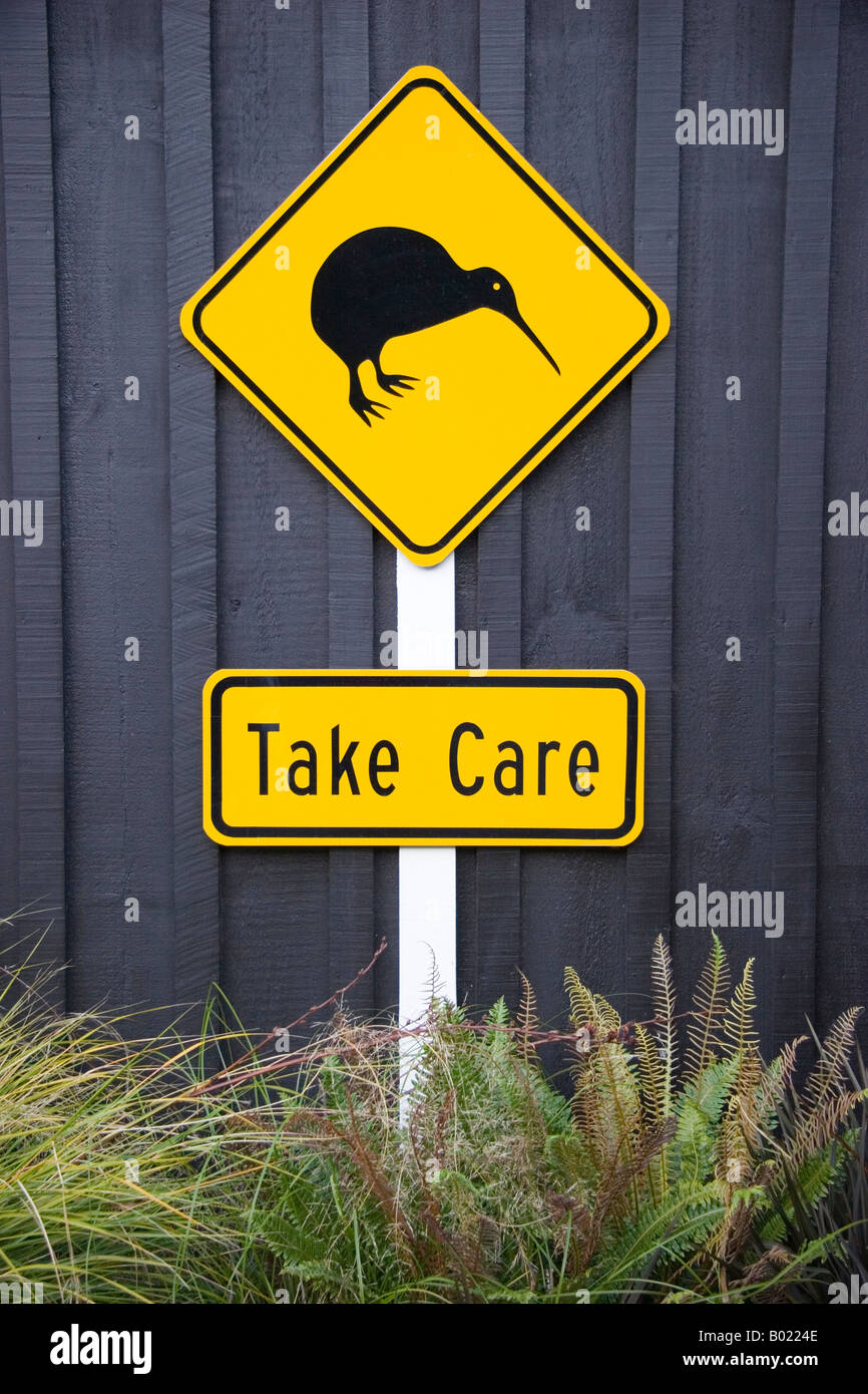 Take care road sign depicting kiwi New Zealand Stock Photo