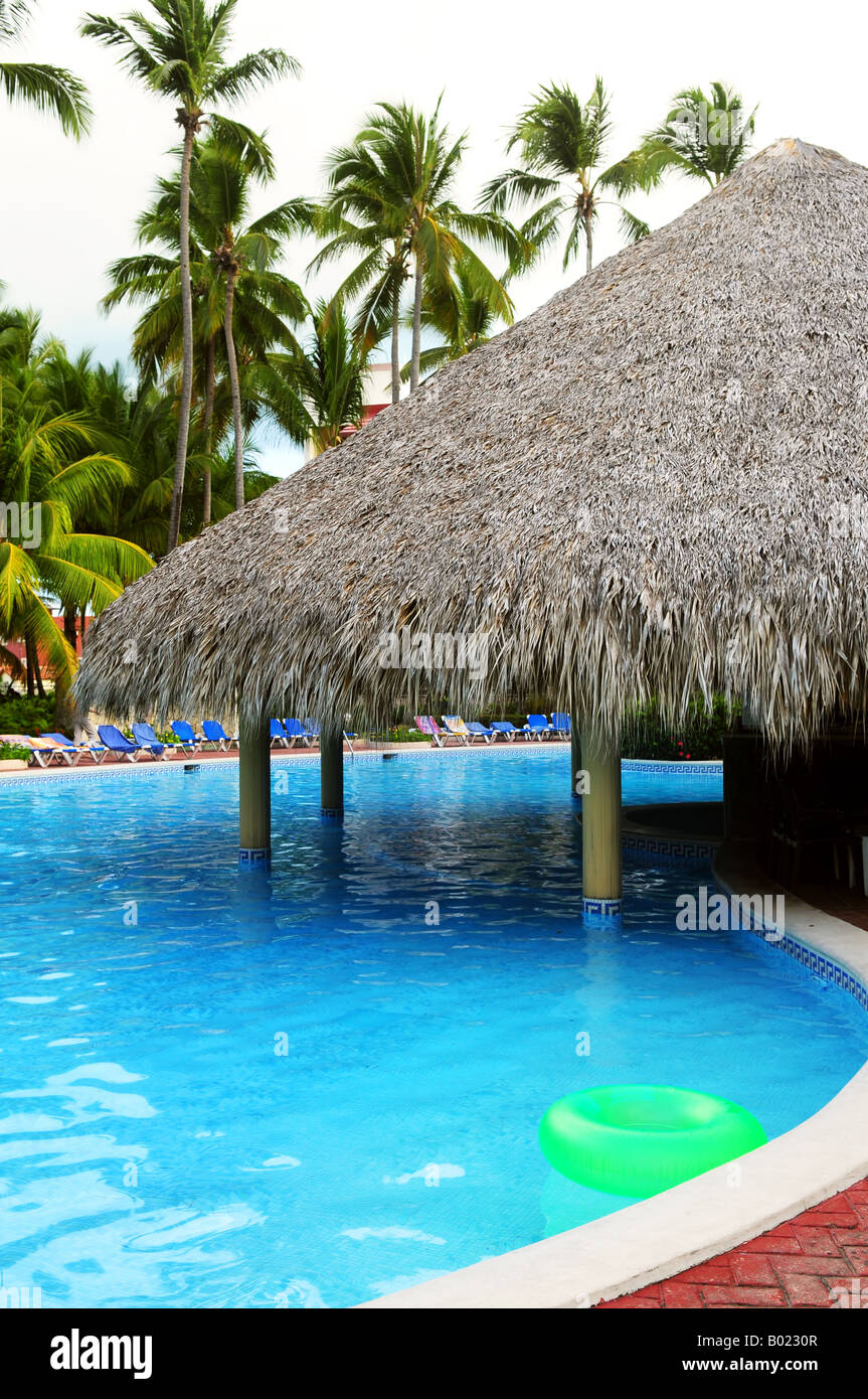 Swimming pool with swim up bar at tropical resort Stock Photo