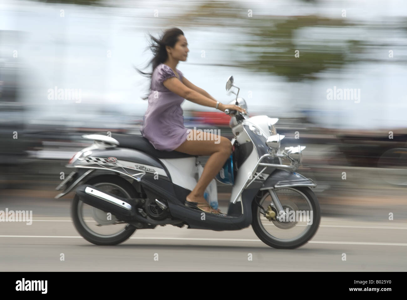 Girl on moped hires stock photography and images Alamy