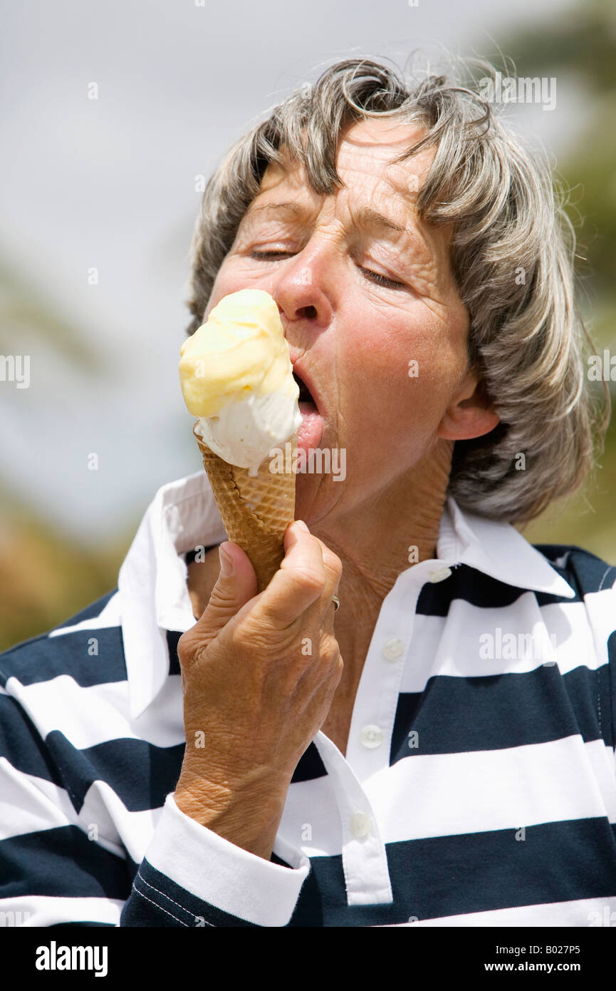 headshot-of-mature-woman-licking-ice-cream-B027P5.jpg