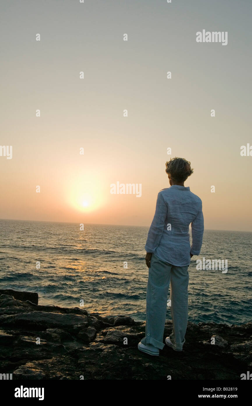 Woman rear view outside alone mature hi-res stock photography and ...