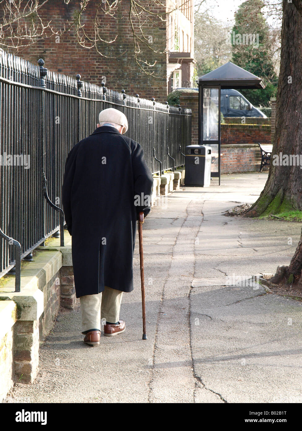 Elderly man walking in an urban environment Stock Photo - Alamy