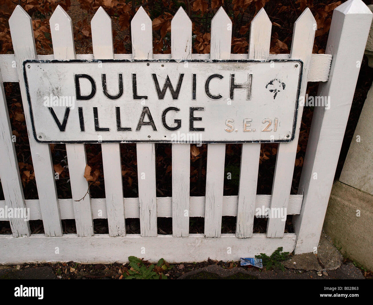 Dulwich Village sign on a white picket fence Southwark London Stock Photo