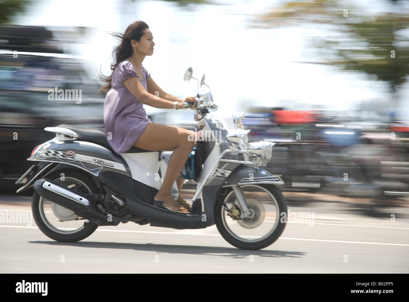 Girl on moped pattaya hi-res stock photography and images - Alamy
