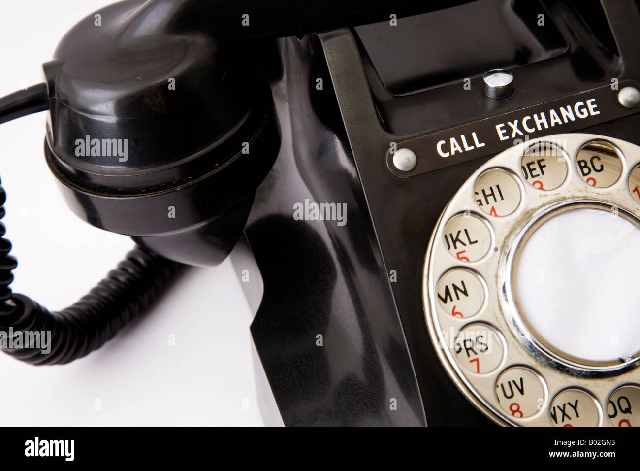 Close up. Old black GPO Post Office 312L Bakelite telephone. Hand set in place and old fashioned dial with CALL EXCHANGE button Stock Photo