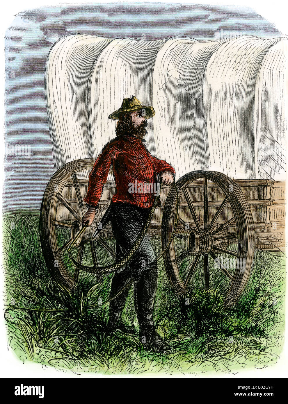Bullwhacker beside a covered wagon on the Santa Fe Trail. Hand-colored woodcut Stock Photo