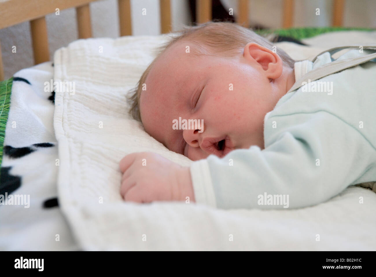 Baby sleeping on his belly Stock Photo Alamy