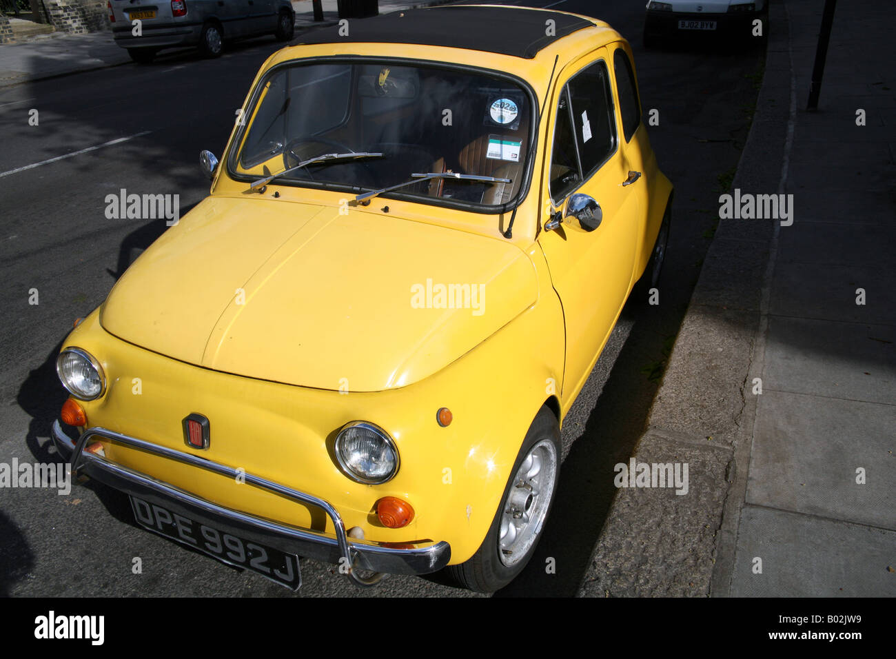Old model Fiat 500 parked on London street Stock Photo - Alamy