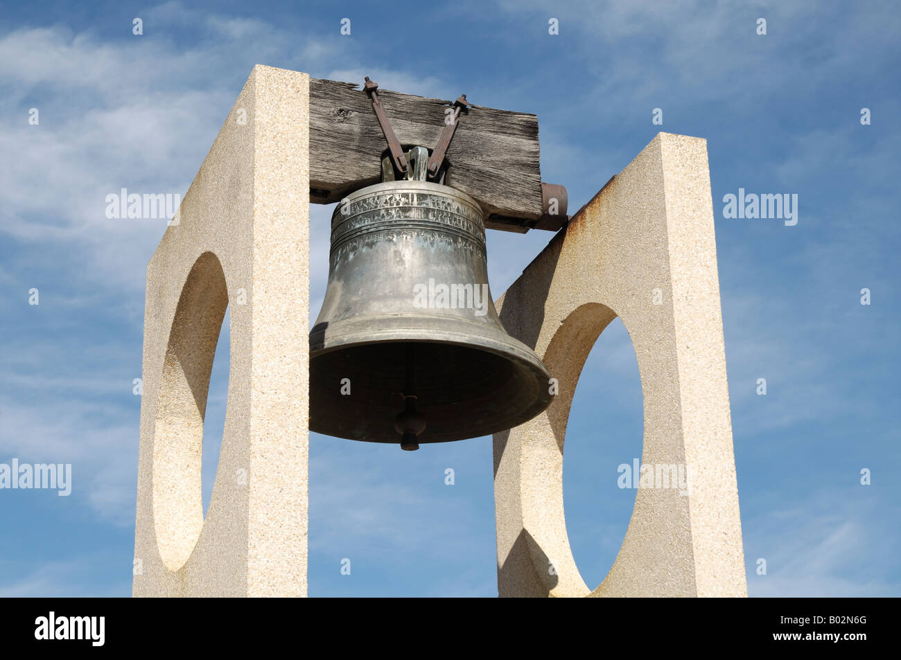 A large freedom or liberty bell replica stands ready to peal out its tone. Stock Photo