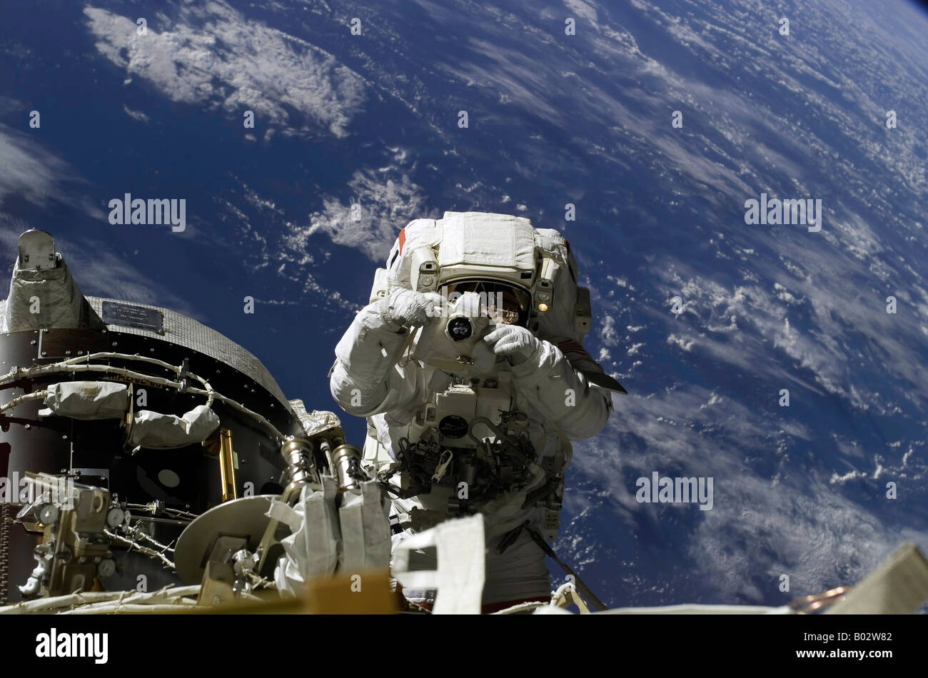 Astronaut participating in extravehicular activity. Stock Photo
