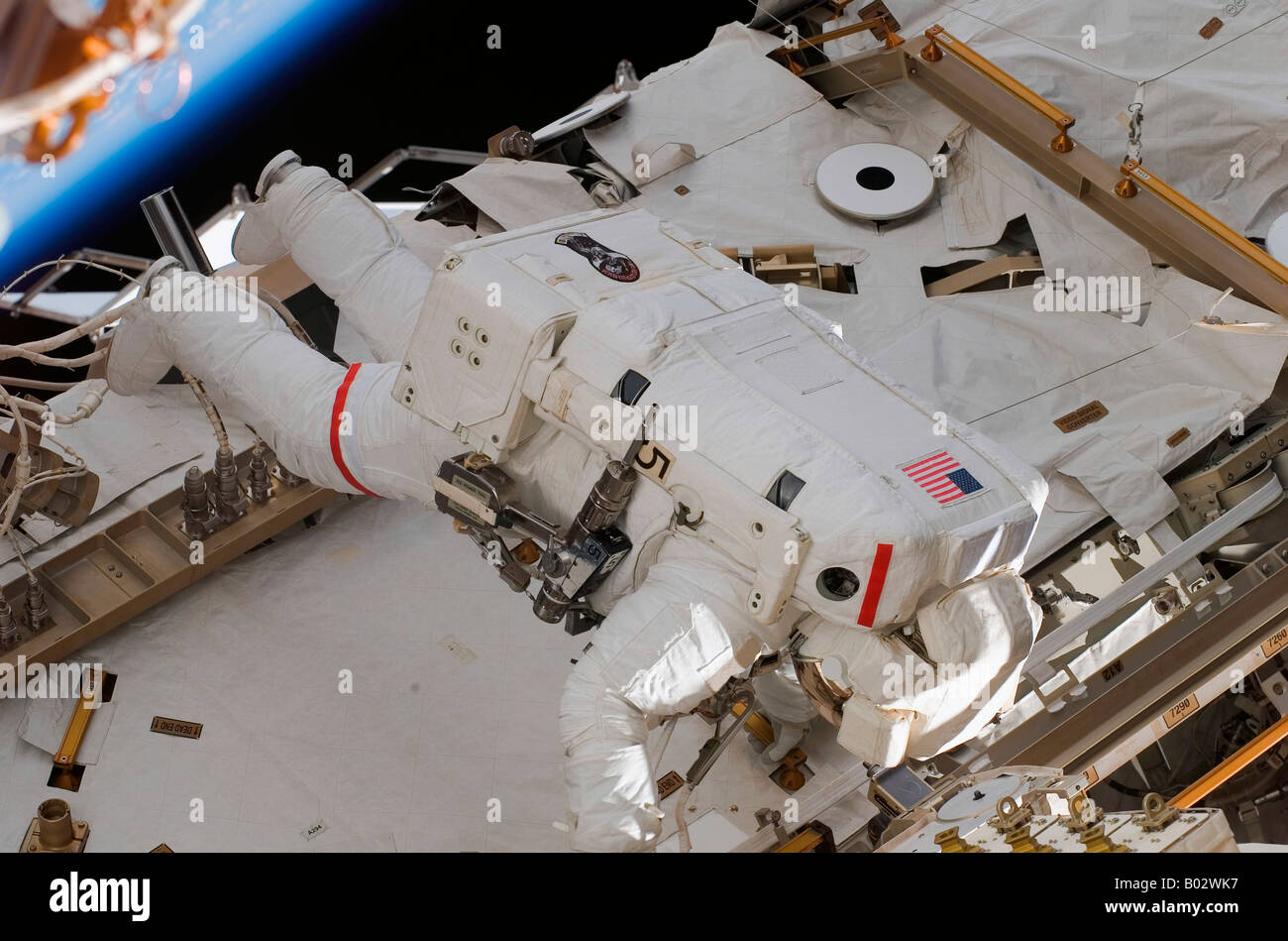 Astronaut partcipating in extravehicular activity. Stock Photo