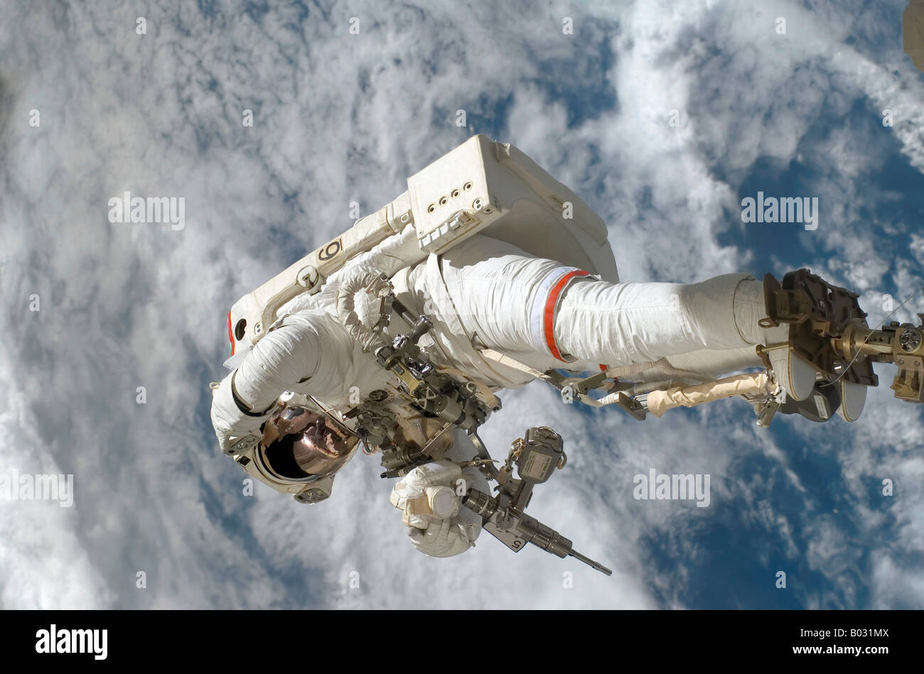 Astronaut participating in extravehicular activity. Stock Photo