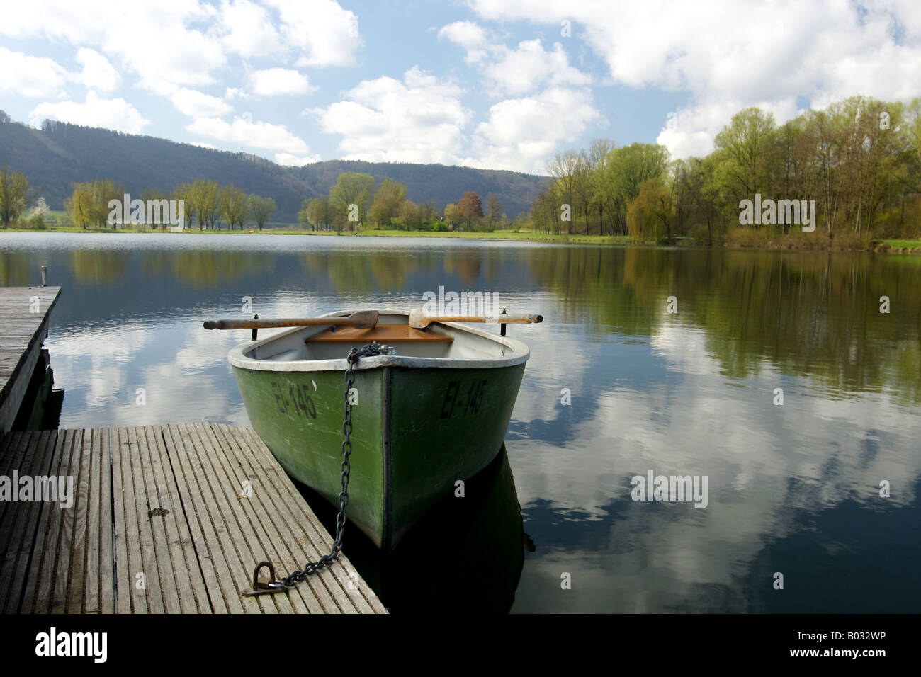 Rowing boat in scenic landscape / Ruderboot in idyllischer Seenlandschaft Stock Photo