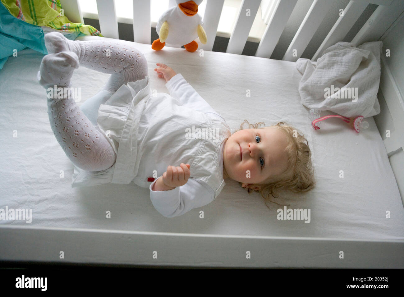 Little baby girl is wakening up Stock Photo