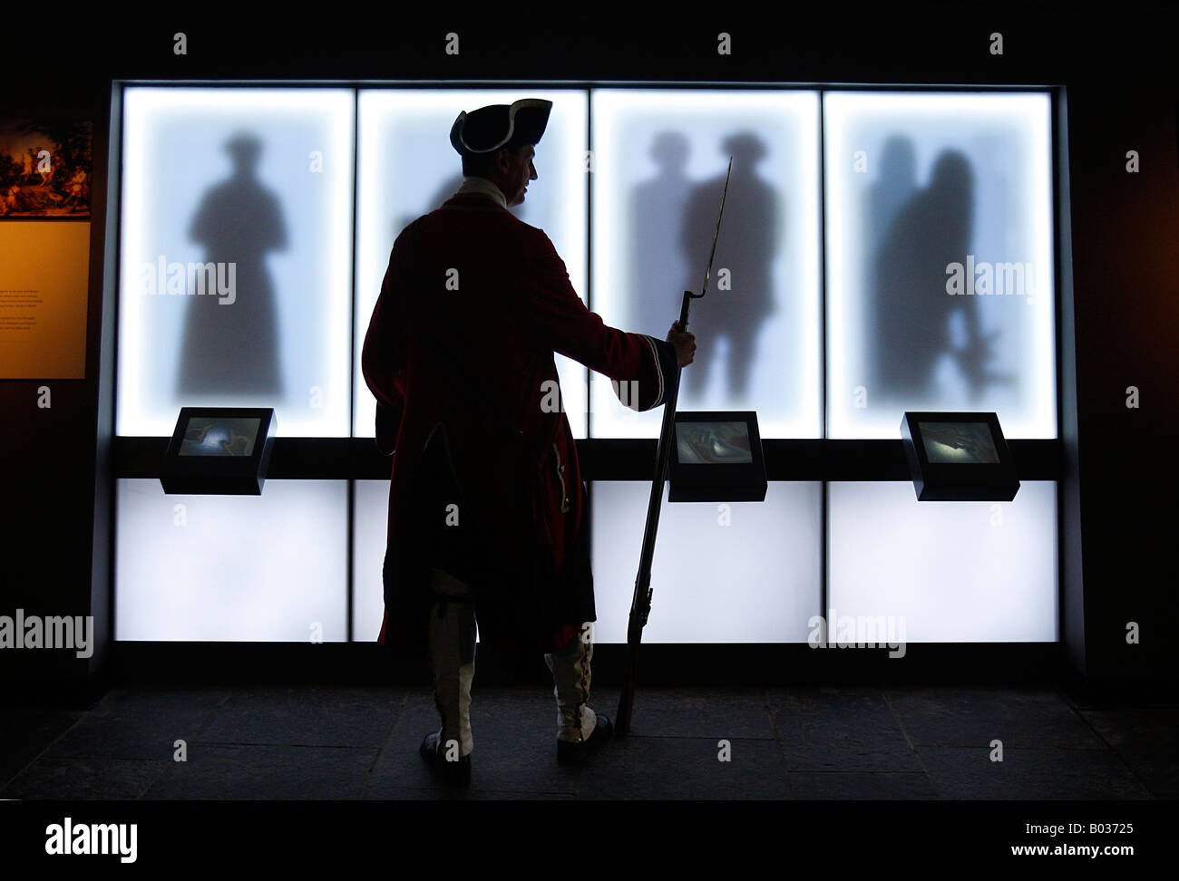 man dressed up as a red coat government soldier inside the visitor centre at Culloden battlefield site when it opened Stock Photo