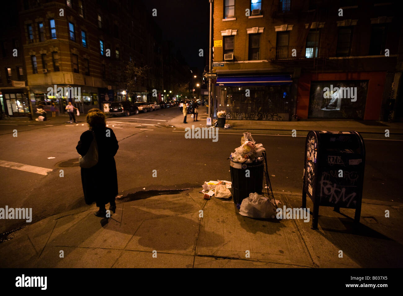 Garbage spilling out of trash cans on this intersection of downtown