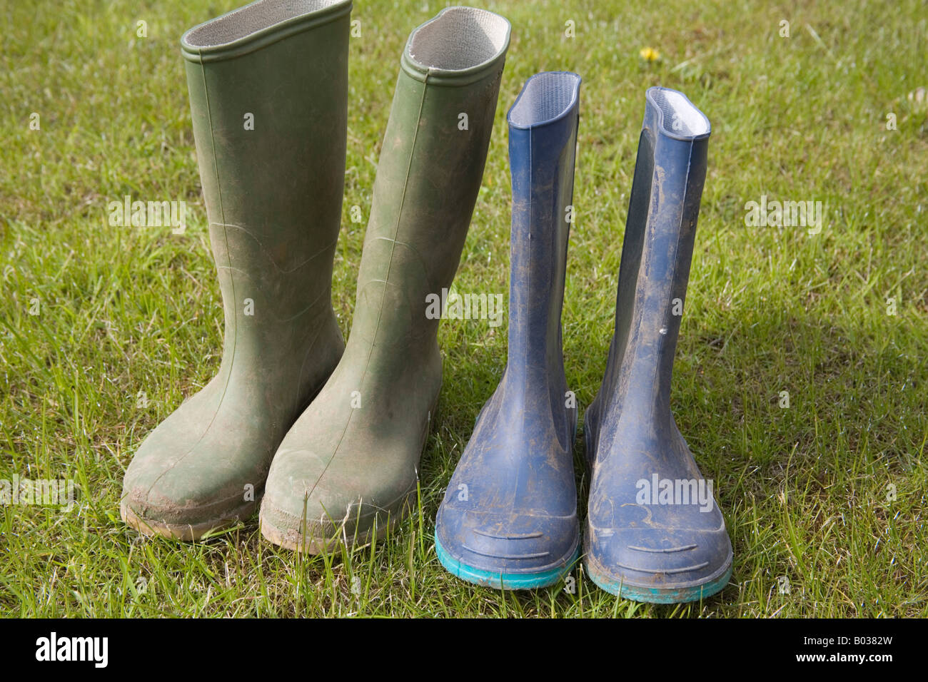 Two pairs of womens muddy wellington boots hi-res stock photography and ...