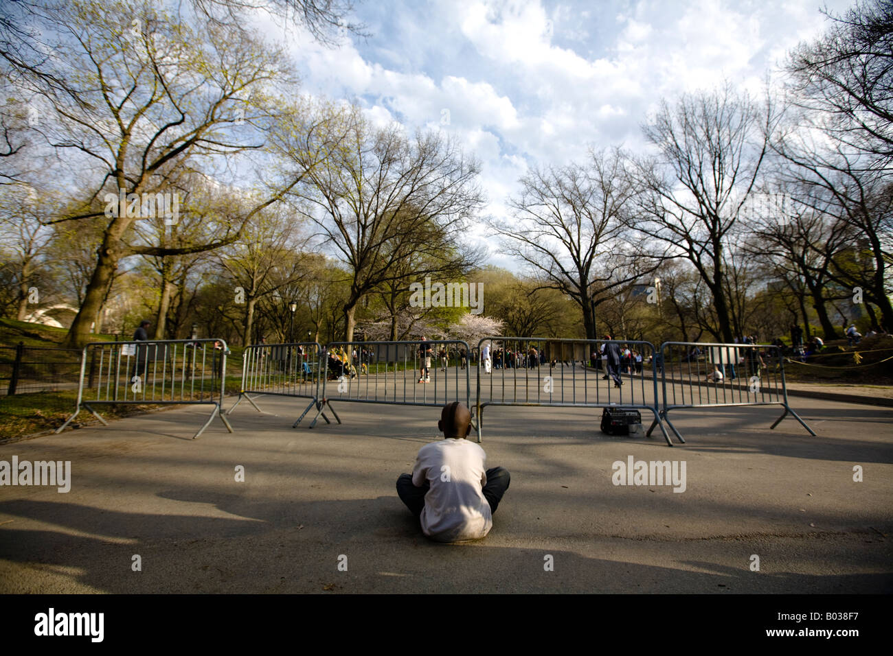 Boy observes people rollerskating and dancing to the music in Central