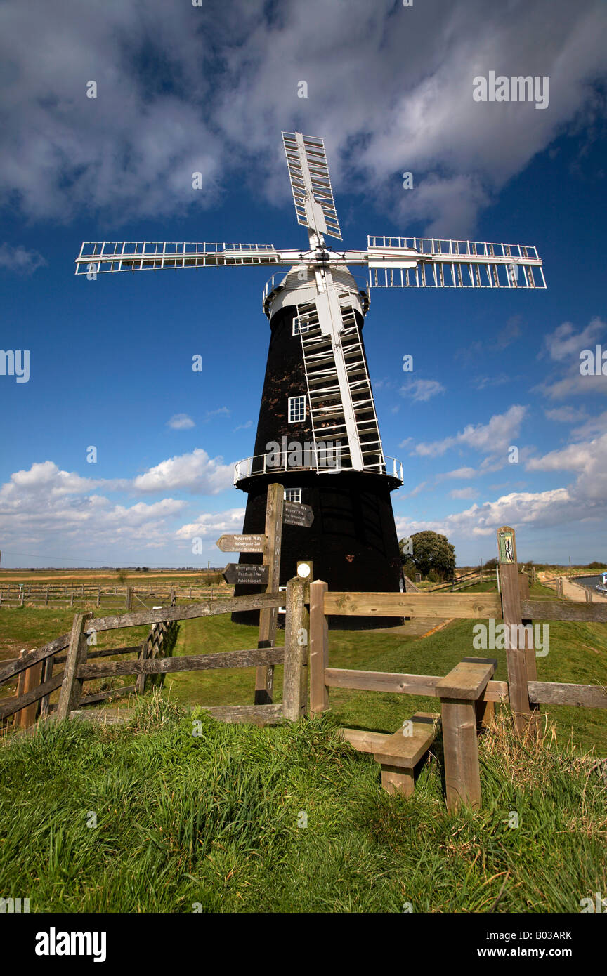 The recently restored Berney Arms windmill & public footpath sign on the Halvergate Marshes, Norfolk Broads. Stock Photo
