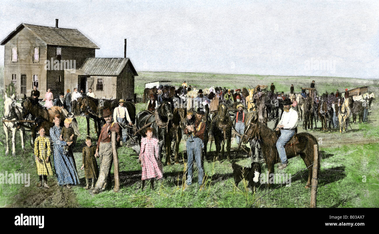 Prairie settlers helping a neighbor with his farm work circa 1900. Hand-colored halftone of a photograph Stock Photo