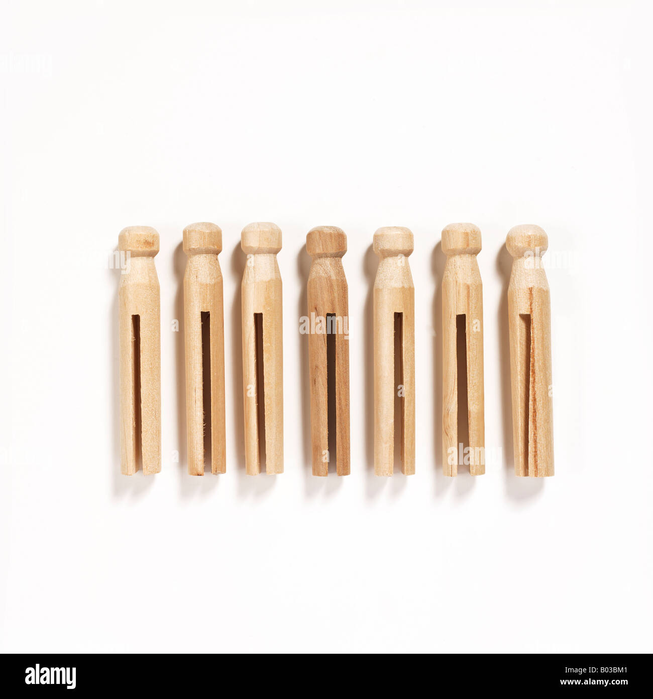 wooden clothespins on white background Stock Photo