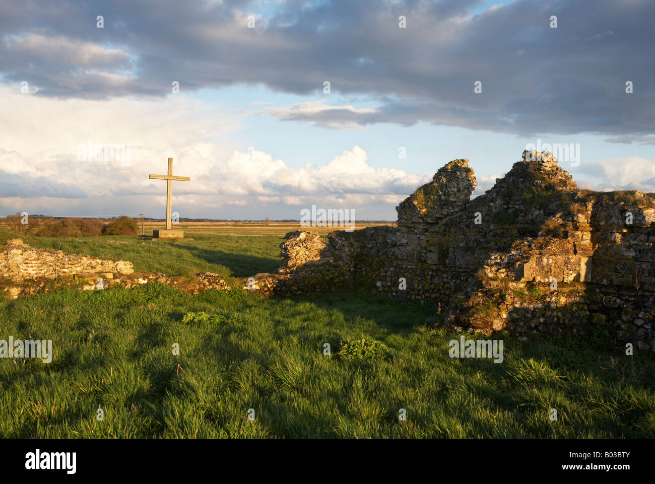 Cross and remains of the former site of St Benets Abbey on the Norfolk Broads Stock Photo
