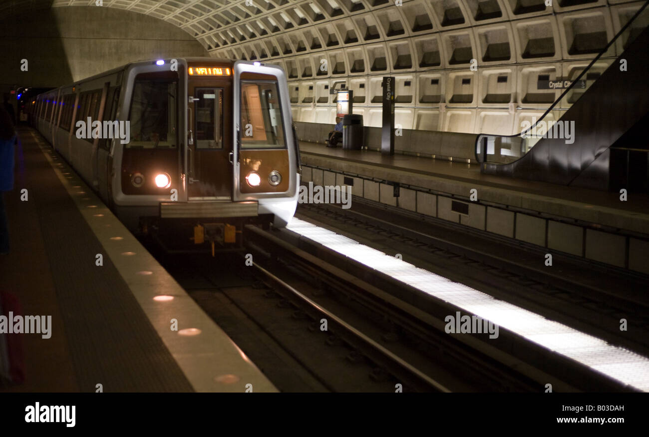 Washington Metrorail Subway Station train arriving A train pulls up to the station The muted light of Washington's subway system Stock Photo