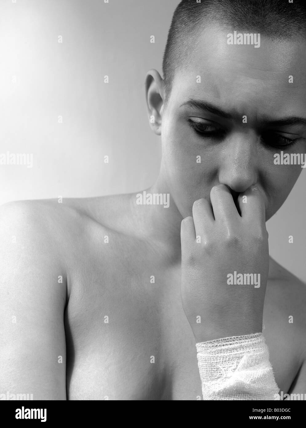 Teen pain: troubled teenager (19) with bandaged wrist Stock Photo