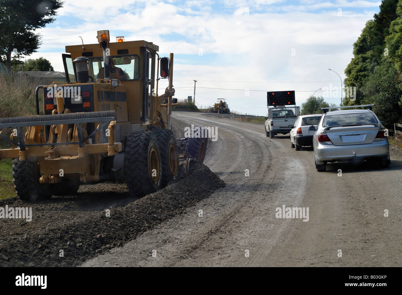 driver stuck behind lorry on dusty road with road works Stock Photo