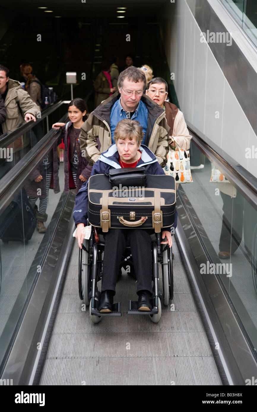 Wheelchair passenger arriving Eurostar train platform via moving