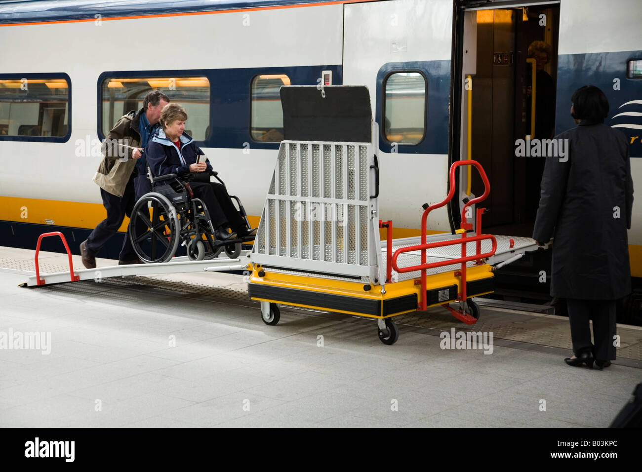 Wheelchair passenger boarding Eurostar train by the means of a ramp at