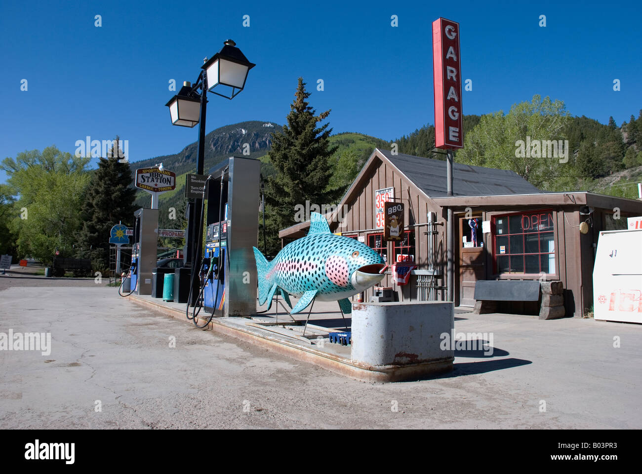 Large trout fish sculpture at Lake City Colorado gas station, USA Stock Photo