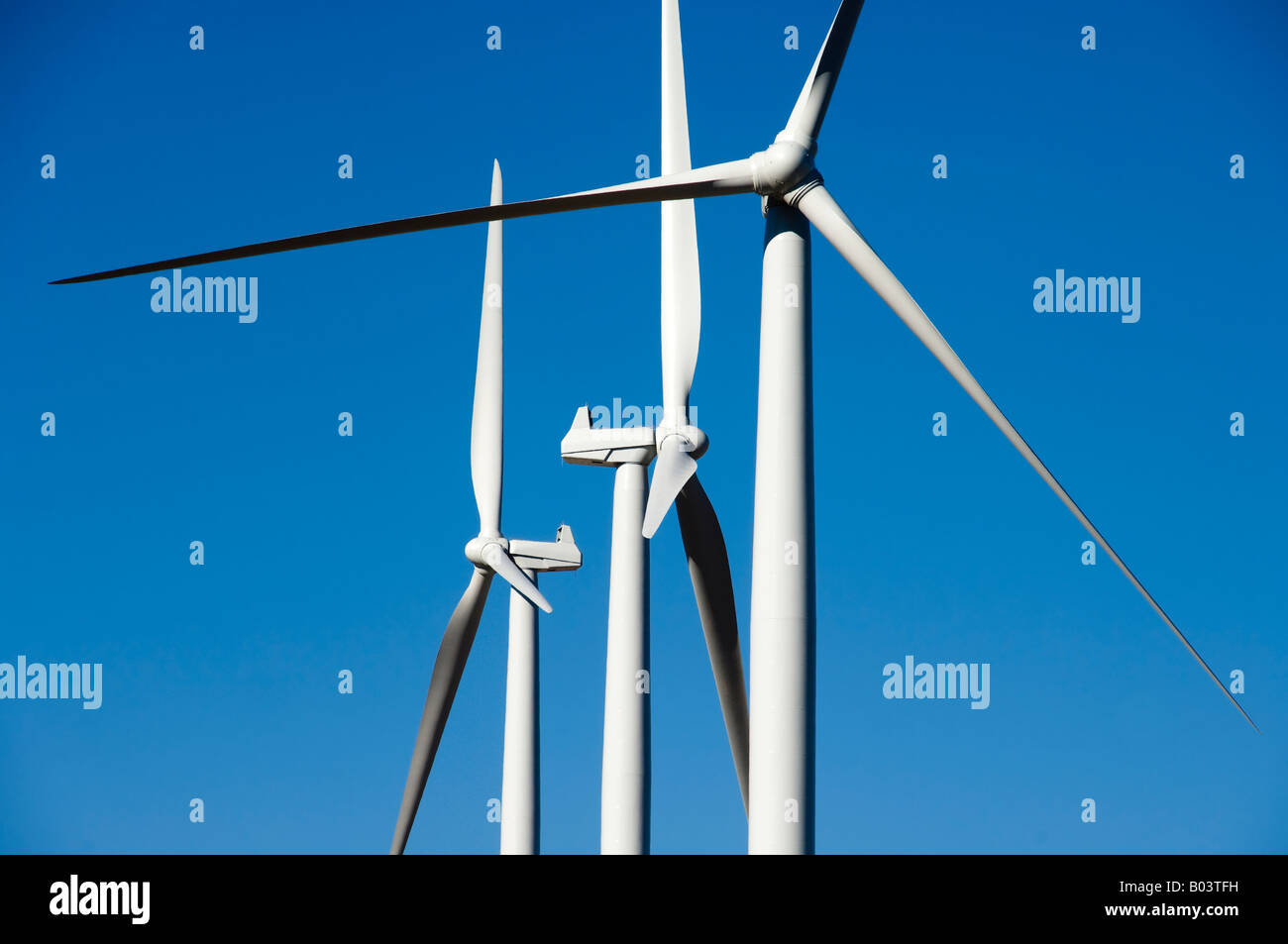 Wind turbines against a blue sky Stock Photo - Alamy