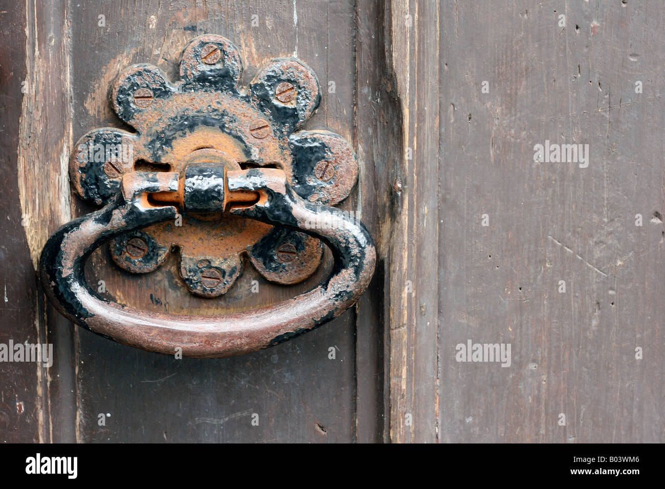 Old metal door handle on black painted wooden door Stock Photo Alamy