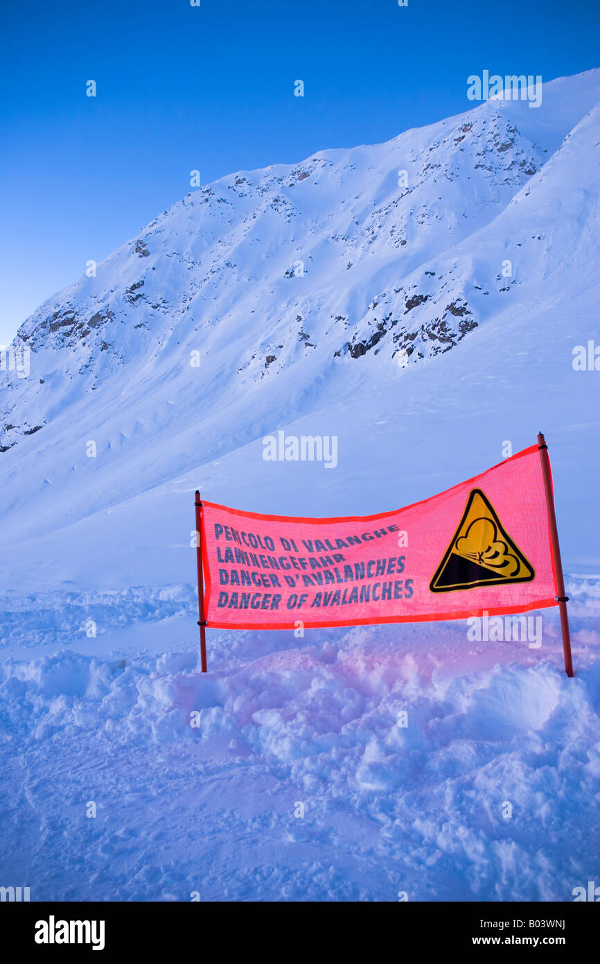 Mountains, deep snow and an avalanche warning above Passo del Tonale Italy Stock Photo