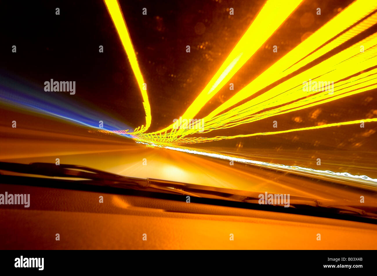 streaks caused by car tail lights at night during long exposure Stock